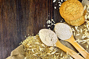 Image showing Flour and bran oat in spoon with grains on board