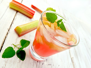 Image showing Lemonade with rhubarb and mint in glassful on board