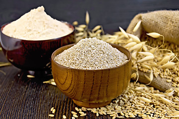 Image showing Bran flakes in bowl with flour on board