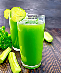 Image showing Juice cucumber in two tall glass on board