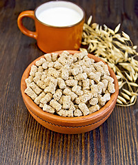 Image showing Bran in bowl on dark board