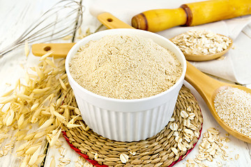 Image showing Flour oat in white bowl on light board