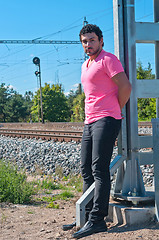 Image showing Handsome young guy in pink t-shirt