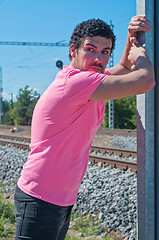 Image showing Handsome young guy in pink t-shirt