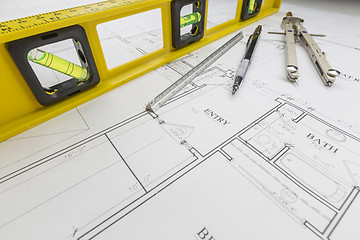 Image showing Construction Level, Pencil, Ruler and Compass Resting on House P