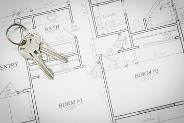 Image showing Set Of New House Keys Resting On House Plans
