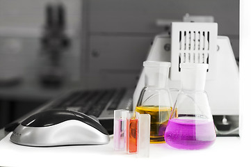 Image showing laboratory flasks and computer keyboard