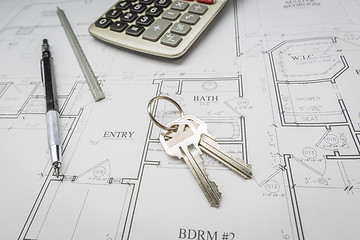 Image showing Pencil, Ruler, Calculator and Keys Resting on House Plans