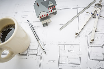 Image showing Home, Coffee, Pencil, Ruler and Compass Resting on House Plans