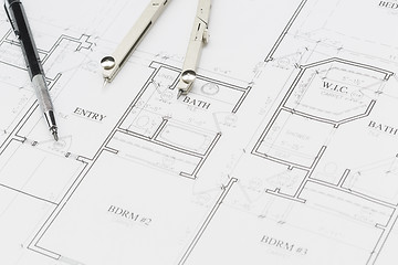 Image showing Engineer Pencil and Compass Resting on House Plans