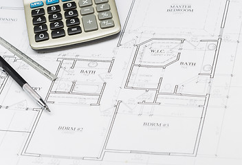 Image showing Pencil, Ruler and Calculator Resting on House Plans