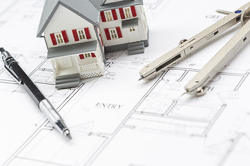 Image showing Model Home, Pencil and Compass Resting On House Plans