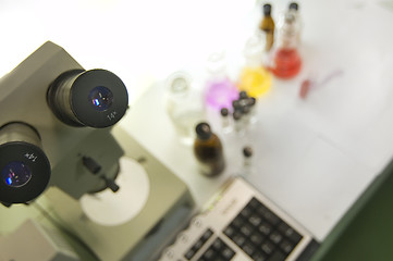 Image showing laboratory work place with microscope and test tubes