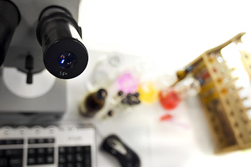 Image showing laboratory work place with microscope and test tubes