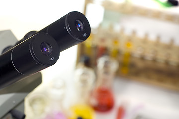 Image showing laboratory work place with microscope and test tubes