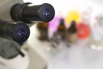 Image showing laboratory work place with microscope and test tubes