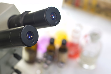 Image showing laboratory work place with microscope and test tubes