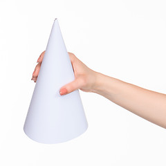 Image showing The cone in female hands on white background