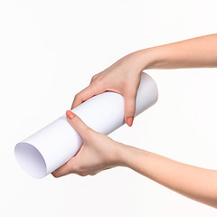 Image showing The cylinder female hands on white background