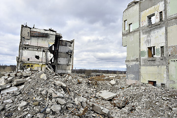 Image showing Pieces of Metal and Stone are Crumbling from Demolished Building