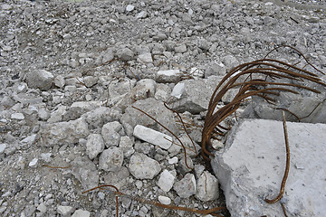 Image showing Pieces of Metal and Stone are Crumbling from Demolished Building