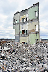 Image showing Pieces of Metal and Stone are Crumbling from Demolished Building