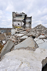 Image showing Pieces of Metal and Stone are Crumbling from Demolished Building