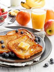 Image showing French toast with butter and honey