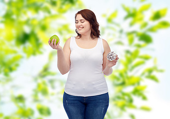 Image showing happy plus size woman choosing apple or donut