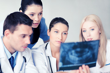 Image showing group of doctors looking at x-ray