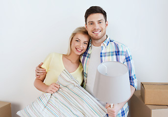 Image showing happy couple with stuff moving to new home