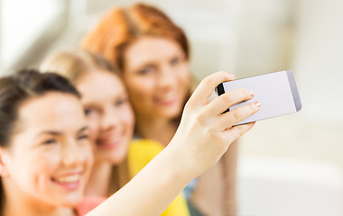 Image showing close up of friends taking selfie with smartphone