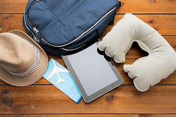 Image showing close up of tablet pc and traveler personal stuff