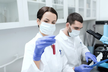 Image showing young scientists making test or research in lab