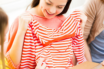 Image showing close up of happy teenage girls with shirt