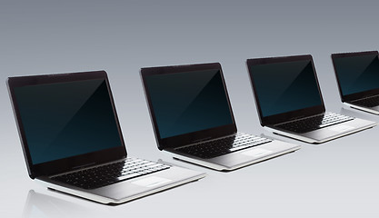 Image showing laptop computers with blank black screen