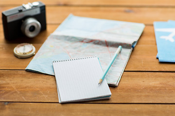 Image showing close up of notepad with map and travel tickets