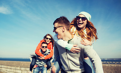 Image showing happy teenage friends having fun outdoors