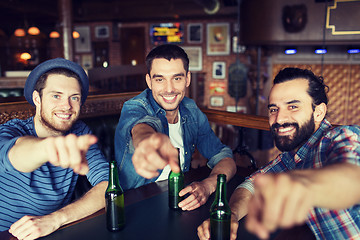 Image showing happy male friends drinking beer at bar or pub