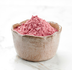 Image showing bowl of pink dried berries fruit powder