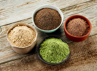 Image showing bowls of various dried plant powders