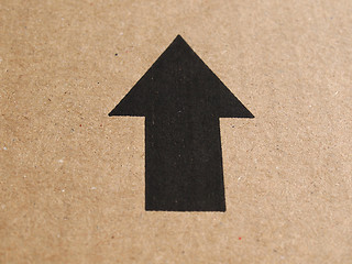 Image showing Black arrow on cardboard