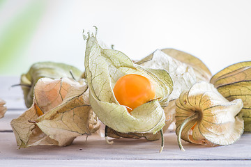 Image showing Physalis peruviana fruit on a table