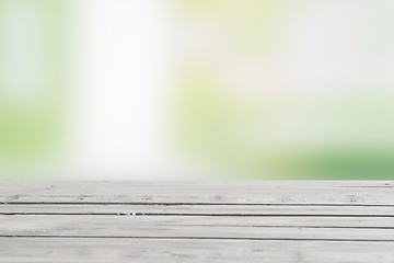 Image showing Wooden table in green nature