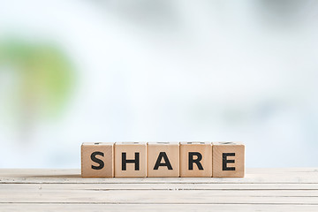 Image showing Share word on a wooden table