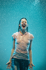 Image showing The portrait of young beautiful woman in the rain