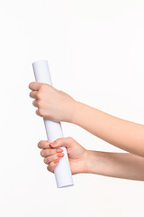 Image showing The cylinder female hands on white background