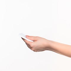 Image showing Female hand holding blank paper for records on white.