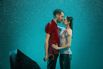 Image showing The loving couple in the rain