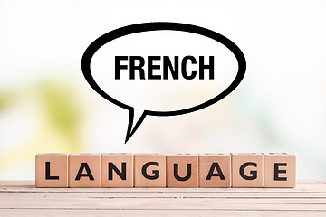 Image showing French language lesson sign on a table